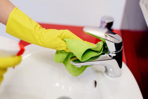 Domestic cleaner tidying a family home in SE24