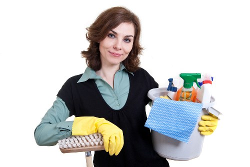 Cleaner sanitising an office meeting room in the SE24 area